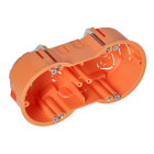 En orange, oval inflld kopplingsdosa med flera frborrade hl och fsthl fr skruvar.