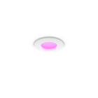 Philips Hue Slim Downlight S WACA En rund, infälld downlight med vit ram och rosa ljus sprider ett mjukt sken från taket.