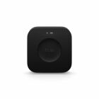 En svart Philips Hue Bridge visas framifrn med en lysande LED-indikator upptill.