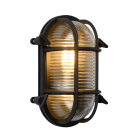 En v�gglampa i m�ssing visas framifr�n mot vit bakgrund med skyddsgaller och r�fflat glas som omsluter ljusk�llan. Elbutik.se erbjuder armaturen med IP65-klassning f�r anv�ndning i utomhusmilj�er och fuktiga utrymmen.